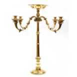 A brass four-branch candelabrum,