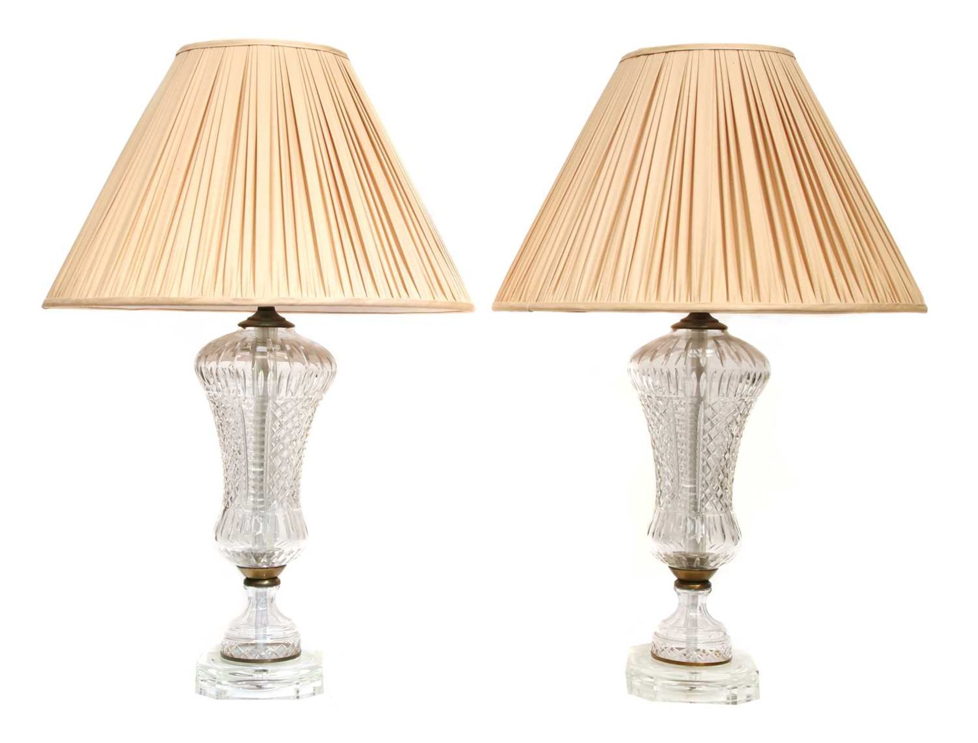 A pair of cut-glass table lamps,