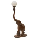 An Indian sandalwood lamp in the form of an elephant,