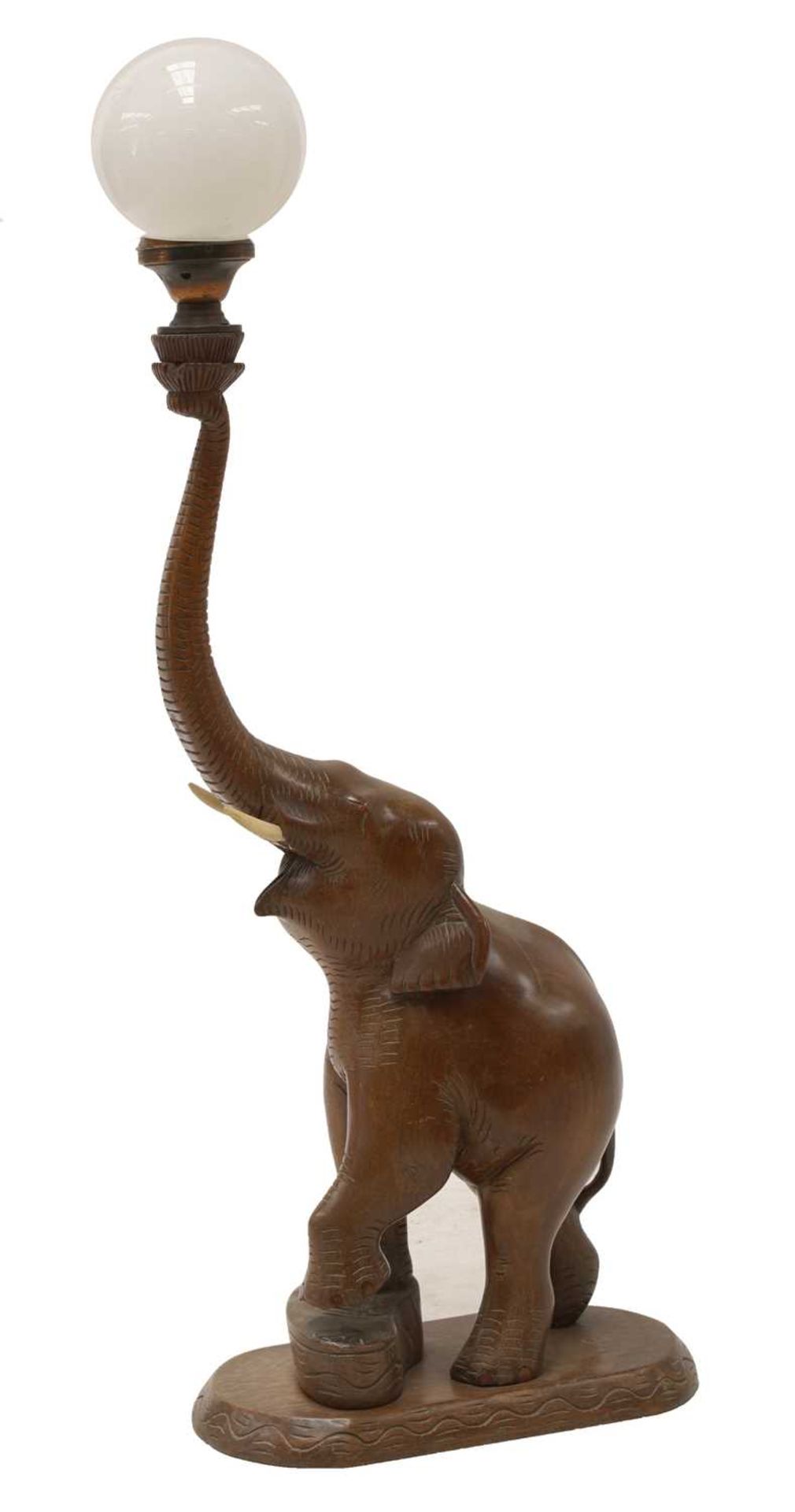 An Indian sandalwood lamp in the form of an elephant,