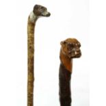 Two dog's head walking sticks,