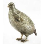 A large silver model of a partridge,