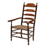 A large fruitwood and parquetry ladder back elbow chair,