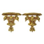 A pair of George III-style wall brackets,