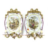 A pair of French faience wall lights,