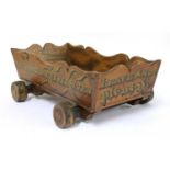 A Victorian elm and inscribed truckle,