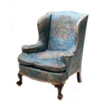 A silk upholstered wingback armchair,