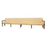 A long leather upholstered bench,