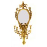 A large giltwood and gesso four-light girandole wall mirror