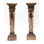 A pair of Louis XVI-style pink marble pedestals,