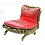 An upholstered low boudoir chair,