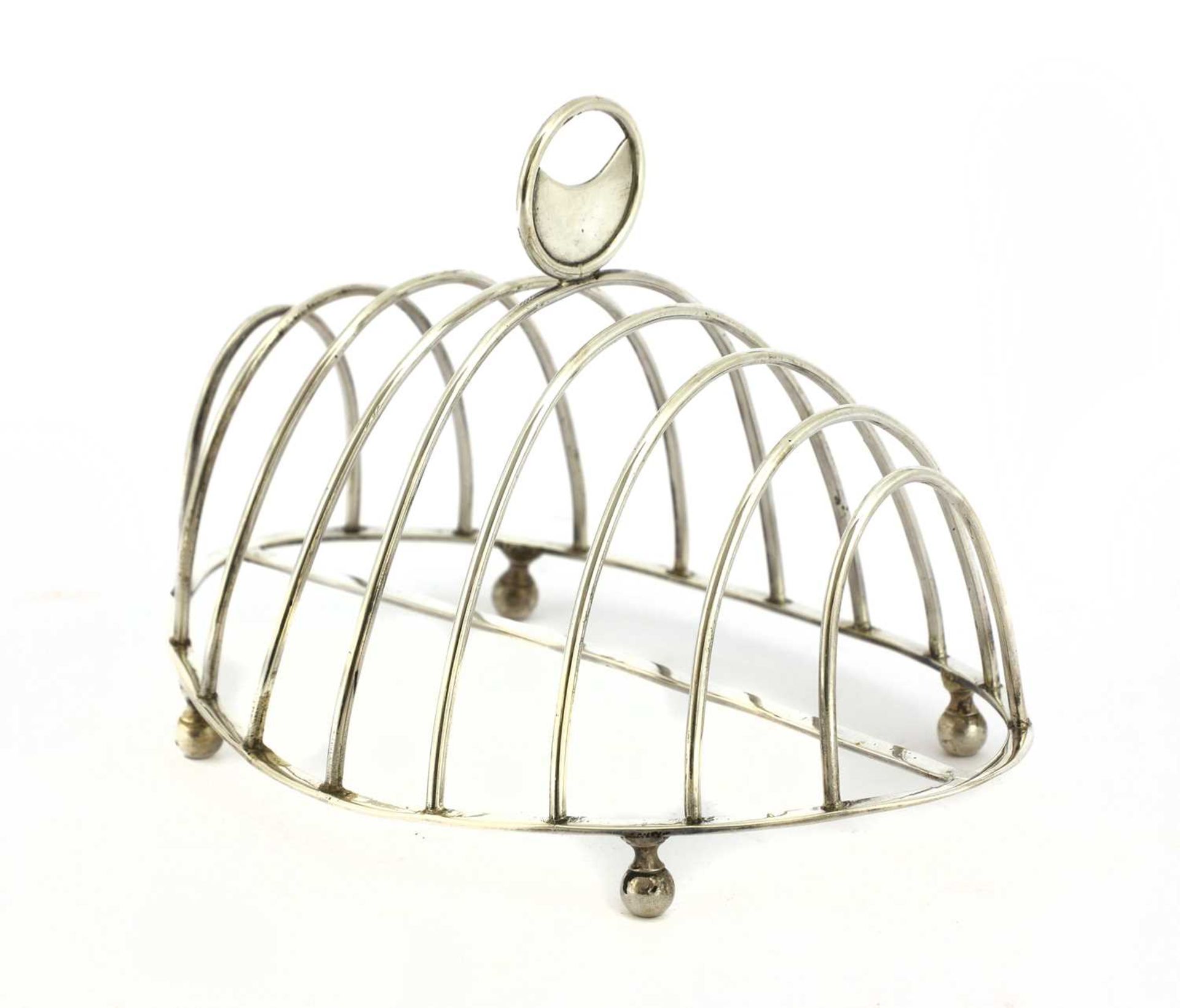 A George III silver oval eight-division toast rack,