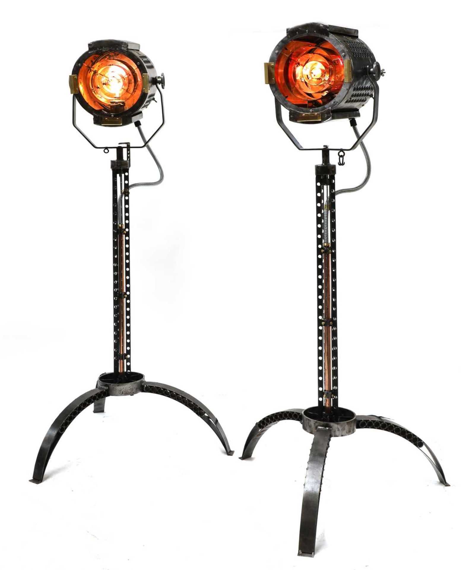 A pair of steel, copper and brass 'Strand' electric stage lights,