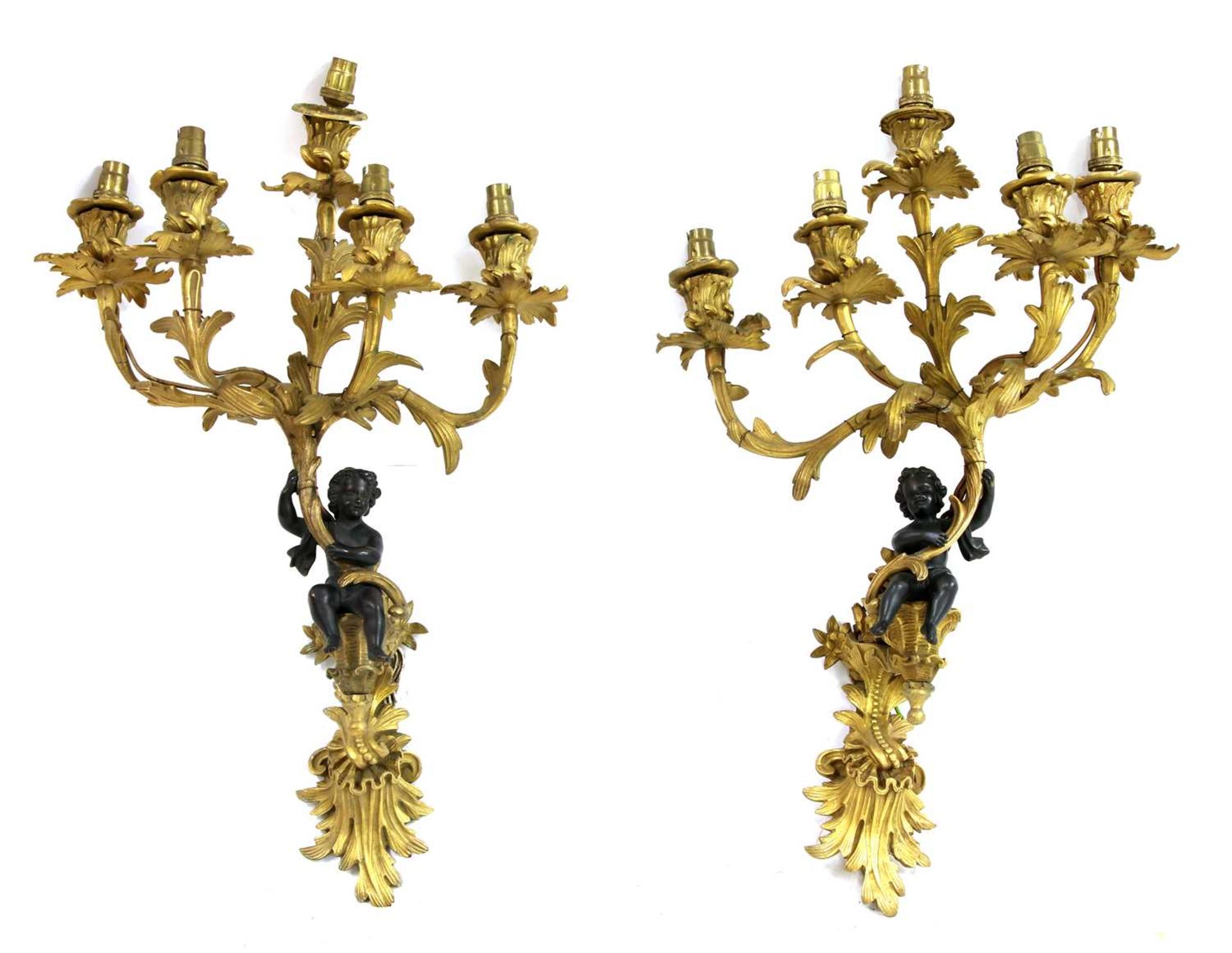 A pair of Louis XV-style ormolu and bronze wall lights,