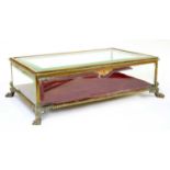 A gilt brass tabletop vitrine,