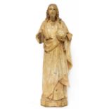A Continental carved and painted pine figure of Christ as Salvator Mundi