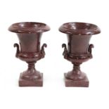 A pair of faux porphyry terracotta urns,