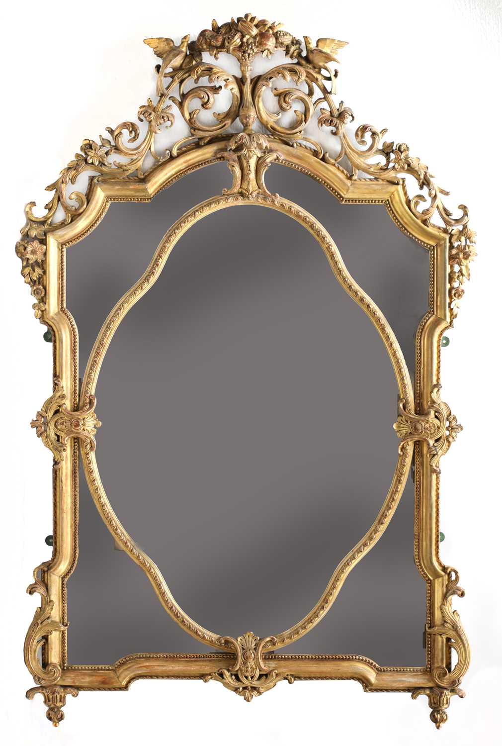 A large giltwood and gesso overmantel mirror,