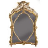 A large giltwood and gesso overmantel mirror,