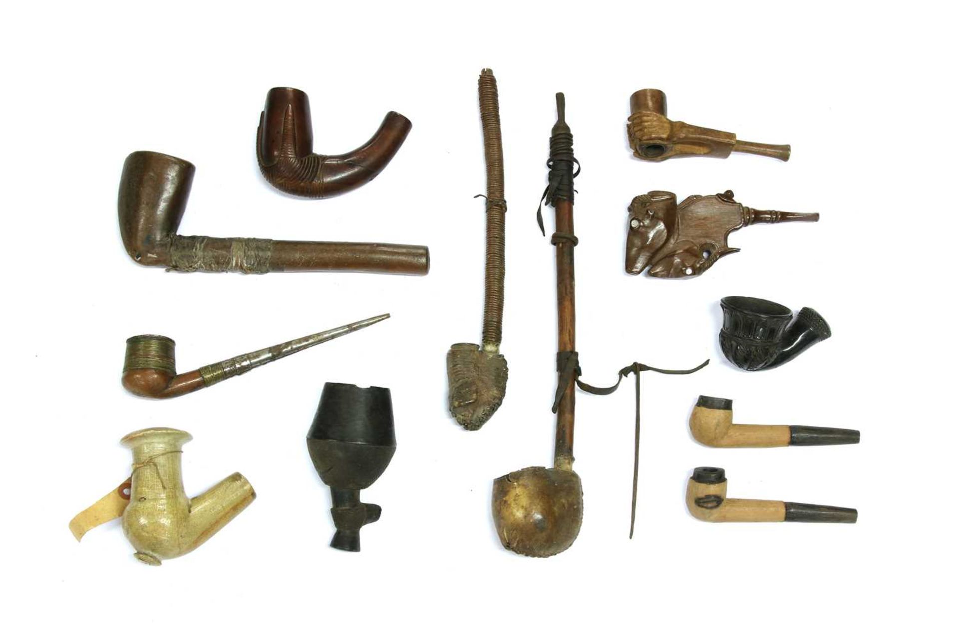 A collection of twelve African pipes,