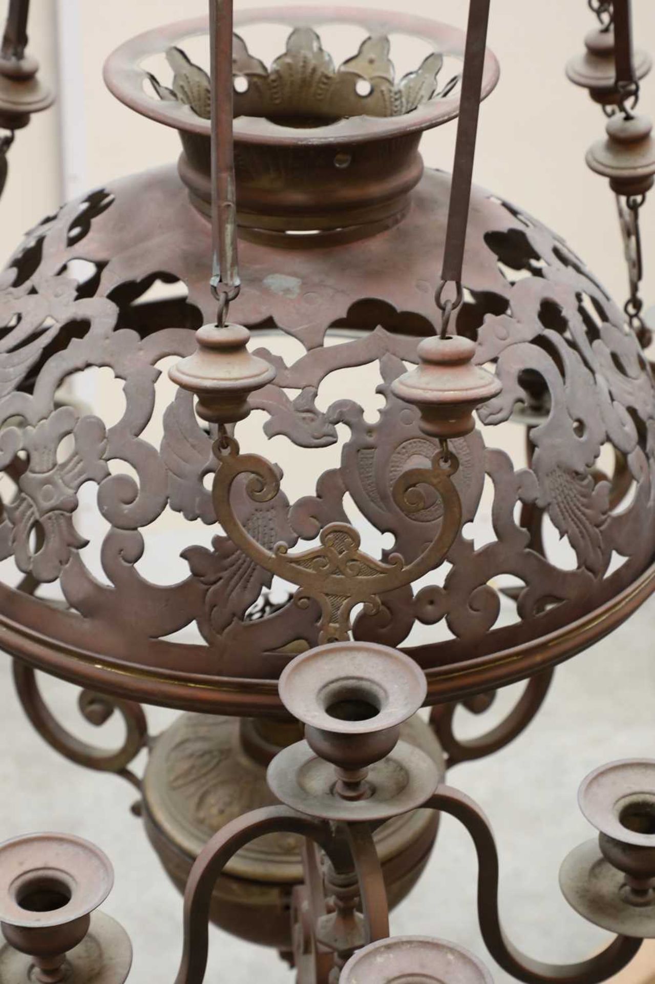 A Victorian twelve-light rise and fall pressed metal chandelier, † - Image 2 of 2