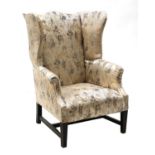A George III-style wingback armchair,