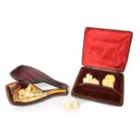 A pipe and two erotic meerschaum cheroot holders,