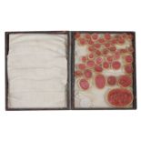 A collection of 38 grand tour red wax intaglios,
