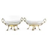 A pair of gilt-plated and cut-glass oval bonbon dishes,