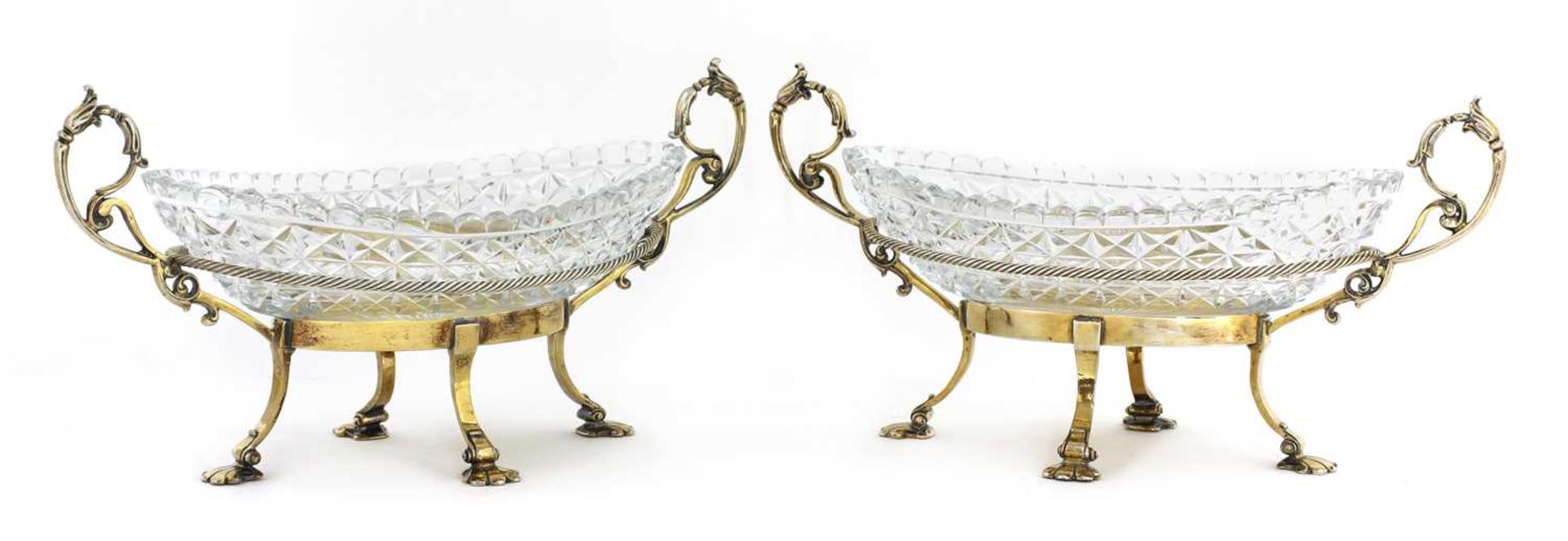 A pair of gilt-plated and cut-glass oval bonbon dishes,