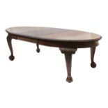 A mahogany wind-out dining table,