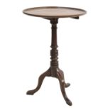 An oak and mahogany circular table,