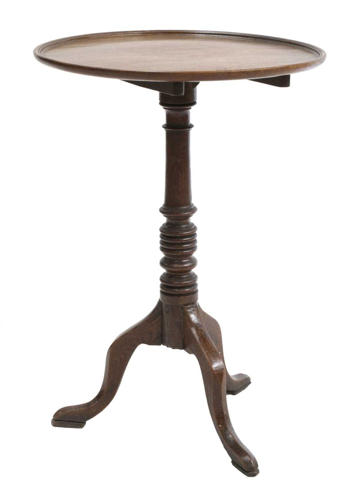 An oak and mahogany circular table,