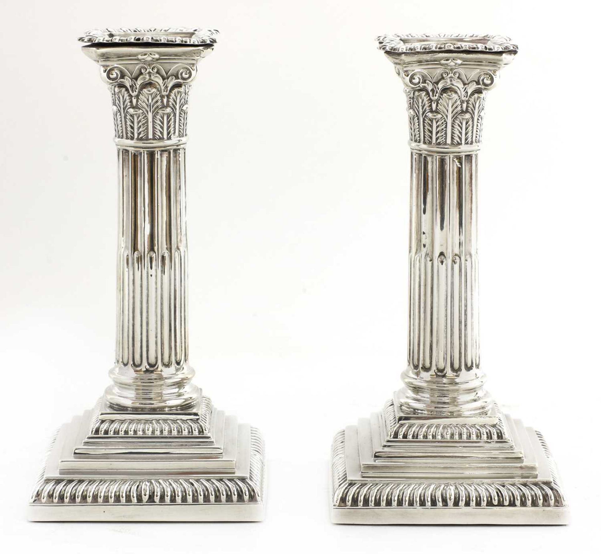 A pair of Victorian silver Corinthian column candlesticks,