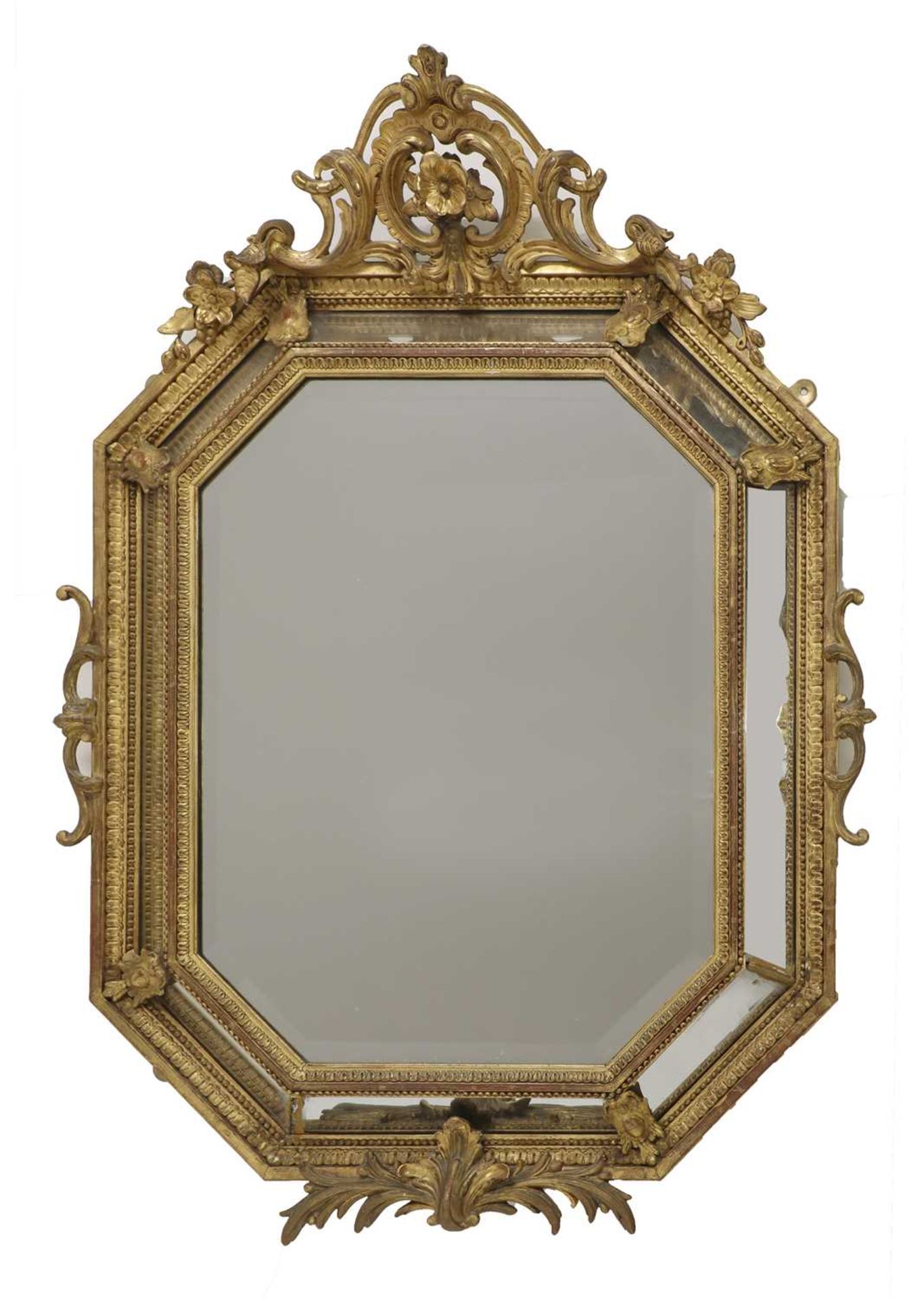 A carved giltwood framed lozenge-shaped wall mirror,