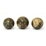 A set of three grand tour marble balls,