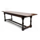An oak plank top refectory table with cleated ends,