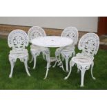 A modern white painted metal garden table and four chairs,