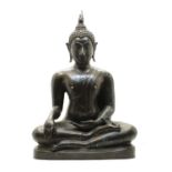 A bronze sculpture of a Buddha,