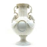 A large French tin glazed earthenware twin handled vase,