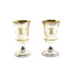 A pair of sterling silver commemorative goblets, by Garrard & Co.,
