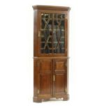 An Edwardian mahogany standing corner cabinet,