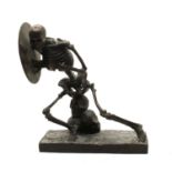 A bronze sculpture of a skeleton gladiator,