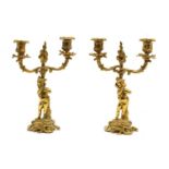 A pair of 18th century style gilt metal two branch candelabra with figure columns,