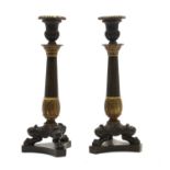 A pair of Napoleon III design bronze and gilt bronze candlesticks,