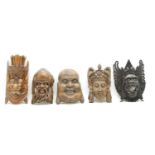 A collection of Far Eastern carved hardwood masks,