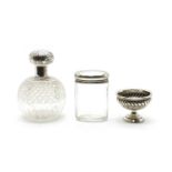 Two silver mounted cut glass dressing table bottles,