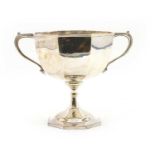 An octagonal twin handled silver trophy cup