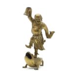 A Chinese brass figure,