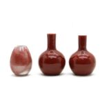 Three modern Chinese red glazed vases,